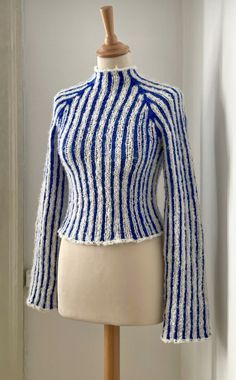 a mannequin wearing a blue and white striped jacket