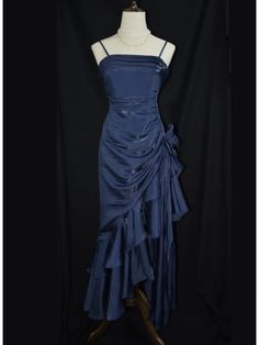 This exquisite dark blue prom gown features a vintage floral design that exudes timeless elegance. The asymmetrical hemline adds a modern twist, creating a captivating silhouette that will make you stand out at any event. Designed with delicate spaghetti straps, this dress is perfect for those special adult milestone celebrations.  Garment Size   	 		 			Size 			XS 			S 			M 			L 			XL 		 		 			Bust 			78 			82 			86 			90 			94 		 		 			Waist 			60 			64 			68 			72 			76 		 		 			Hips 			84 Winter Formal Dress Blue, Evening Prom Dresses, Dark Violet Prom Dress, 90 Prom Dress, Blue Dress Semi Formal, Dark Blue Elegant Dress, Blue Reception Dress, Elegant Dark Blue Dress, Blue Vintage Prom Dress