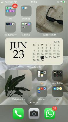 an iphone screen with the calendar on it and icons for different devices in front of it