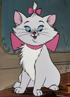 a white cat with blue eyes and a pink bow around its neck sitting on a table