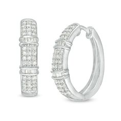 A contemporary classic, these diamond hoop earrings pair well with most any attire. Created in sterling silver, each sophisticated hoop features three rows of sparkling round diamonds. A pair of collars lined with channel-set baguette-cut diamonds adds interest to the style. Radiant with 1 ct. t.w. of diamonds and a brilliant buffed luster, these earrings secure with hinged backs. Zales Jewelry Earrings, Classic Silver Baguette-cut Hoop Earrings, Classic Silver Baguette Cut Hoop Earrings, Classic Silver Hoop Earrings With Baguette Diamonds, Classic Hoop Earrings With Baguette Diamonds, Classic Round Diamond Earrings With Baguette Diamonds, Classic White Gold Hoop Earrings With Baguette Cut, Silver Hoop Earrings With Baguette Diamonds For Anniversary, Classic Anniversary Hoop Earrings With Baguette Diamonds