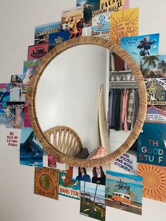 there is a mirror that has pictures on it and some books in front of it