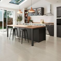 a kitchen with an island and two stools