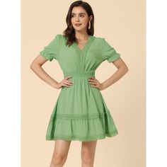 Cut to an elegant fit-and-flare style, this mini dress is sure to serve you well on summer days. The dreamy solid color and a ruffled tiered hem bring casual romance to this puff-sleeved dress. Indulge in the fanciful frills on this vacation-ready dress. It is fashioned with a signature v-neck, a crochet trim, and a layered skirt. Mini and flowy, this gorgeous dress is detailed with bubble sleeves, and a lace panel, for a peasant look, which is sure to elevate your beach-day looks. Smocked Bodice Fit And Flare Mini Dress, Fit And Flare Mini Dress For Spring, Mini Dress With Smocked Back In Specific Color, Solid Summer Mini Dress With Ruffle Hem, Green Fit And Flare Mini Dress For Summer, Casual A-line Mini Dress With Smocked Bodice, Solid Color Summer Mini Dress With Ruffle Hem, Knee-length Summer Mini Dress, Summer Fit And Flare Mini Dress With Smocked Back