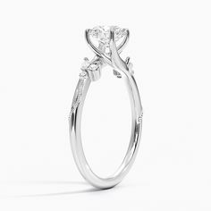 a white gold engagement ring with three stones