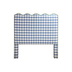 a blue and white checkered headboard with scalloped edges