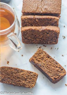 slices of chocolate cake next to a cup of tea