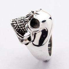 Do you like skulls? Are you looking for a new men's ring for your collection? If so then this a great piece to consider. The heavy sterling silver design is durable and resists the wear and tear of the road easily. The laughing skull design is a great piece that is a perfect addition to any men's accessory collection. It is a comfortable yet masculine ring, one that you will not be disappointed with. Order yours today while you still can! Ring width : 21x25mm Ring weight : 27 grams material: .92 Gothic Skull Ring Stamped 925, Sterling Silver Skull Ring With Engraving, Sterling Silver Skull Ring Engraved, Sterling Silver Skull Ring Hallmarked, Collectible Sterling Silver Skull Ring With Polished Finish, Sterling Silver Engraved Skull Ring, Sterling Silver Skull Ring Stamped 925, Sterling Silver Skull Ring Collectible, Collectible Sterling Silver Skull Ring