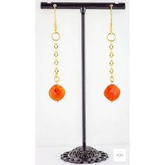 These stunning Carnelian Dangle Earrings offer a perfect blend of minimalist boho chic style and bold elegance. Featuring vivid real carnelian gemstones, these orange and gold dangle earrings add a dainty yet striking pop of color to your wardrobe. The rich burnt orange and pumpkin orange tones of the carnelian gemstones are beautifully complemented by a gold-plated oval link chain and gold-plated ear wires, creating a luxurious and sophisticated look. With their shimmering finish and chic desig Orange Carnelian Earrings For Gift, Elegant Orange Carnelian Earrings, Orange Carnelian Dangle Earrings, Handmade Orange Carnelian Earrings, Handmade Carnelian Orange Earrings, Nickel Free Carnelian Orange Earrings, Elegant Orange Earrings With Dangling Beads, Orange Faceted Beads Dangle Earrings, Orange Carnelian