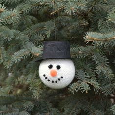 a snowman ornament hanging from a tree with the words frosty the snowman diy christmas ornament