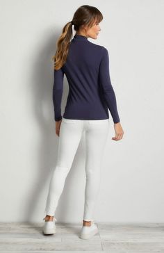 This stylish women's travel shirt is crafted with silky, stretch jersey fabric, perfect for anywhere you want to go. Slim fit 1/4 zip turtleneck Long sleeve Silky mid-weight stretch jersey Length hits just at the hip Modern Athleisure, Curvy Pants, Summer Neutrals, Zip Shirt, Panel Leggings, Travel Shirt, Safari Jacket, Turtleneck Long Sleeve, Travel Shirts