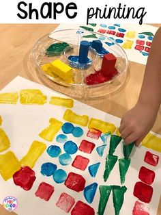 a child's hands painting shapes on paper with the words shape printing in front of them