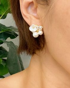 This item is excluded from all promotions and coupons. Add a touch of magic to your outfit with our Mini Flower Jeweled Stud Earrings. These elegant earrings feature a stunning flower design with sparkling details and a delicate pearl accent. They are the perfect accessory to add some sparkle and charm to any look. Delicate White Pearl Earrings, Flower Shaped Pearl Earrings With Pearl Drop, Delicate Pearl White Flower Earrings For Pierced Ears, White Flower Earrings With Pearl Drop, White Feminine Earrings With Flower Decoration, Delicate Pearl Flower Earrings, Pearl White Flower Pearl Earrings, Delicate Pearl White Flower Pearl Earrings, Elegant White Flower Earrings