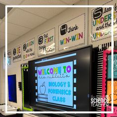 a classroom with posters on the wall and bulletin board