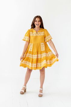 Features Notched Vneck Embroidered Tiers Dress: 100% Cotton, Lining: 95% Polyester 5% Spandex Size + Fit Small 0-4, Medium 4-8, Large 8-12 Model is 5'4" and wearing a small Runs true to size Bust Measurements are taken while laying flat and doubled Size Bust Length Small 34" 36" Medium 36" 36" Large 38" 37" Flowy V-neck Embroidered Dress, Casual V-neck Dress With Embroidered Hem, Vacation V-neck Dress With Embroidered Hem, Yellow Embroidered V-neck Dress, Casual V-neck Embroidered Summer Dress, V-neck Embroidered Dress With Embroidered Neckline, Casual Embroidered Mini Dress, Embroidered V-neck Dress, Casual Yellow Dresses With Floral Embroidery