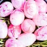 a bowl filled with lots of pink flowers