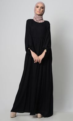 A perfect wardrobe piece for minimalistic style Simple and classy details A stylish abaya with a waist detail adding panel, gather and pleat Includes both side pockets Round neck basic style Full Sleeves FABRIC: Rayon CARE: Machine wash cold Maxi Length Abaya For Fall Workwear, Elegant Solid Color Abaya For Fall, Elegant Solid Abaya For Fall, Solid Long Sleeve Maxi Dress For Eid, Fall Workwear Abaya In Maxi Length, Fall Workwear Maxi Length Abaya, Elegant Abaya With Modesty Panel For Fall, Elegant Fall Abaya With Modesty Panel, Solid Color Abaya With Modesty Panel For Eid