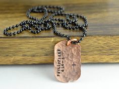 a necklace with a cross on it that says, jesus is my father's blessing