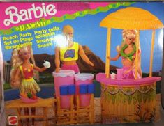 a barbie beach party set with two girls standing next to an umbrella and stools