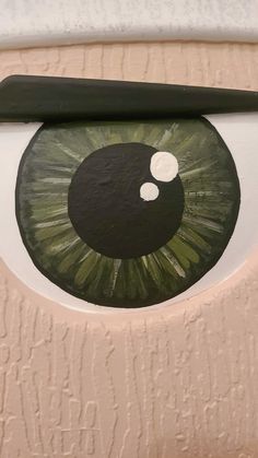 an eyeball painted on the side of a door with black and white circles around it