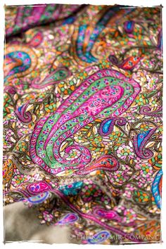 an image of a colorful paisley pattern on a fabric material that looks like it has been dyed