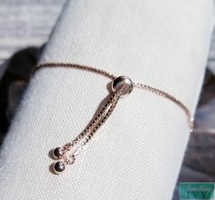 ❤Shop with us online at - https://SomethingIvy.com/❤ Adjustable Rose Gold Bracelet - Rose Gold Jewelry - Bracelets - Rose Gold Hand Jewelry Fits any wrist! Adjustable notch allows for pull draw string style. Matching Earrings available! Sign up for promotions here - https://somethingivy.com/pages/promo-sign-up Lovely bracelet, available in Bulk for Bridesmaids Orders or Group orders, please message. The bracelet is rose gold plate and cubic zirconia Pairs well with our rose gold tiaras, rose gol Adjustable Chain Bracelet For Wedding On Valentine's Day, Elegant Adjustable Chain Bracelet For Valentine's Day, Adjustable Bracelets For Valentine's Day Formal, Rose Gold Jubilee Beaded Bracelet As Gift, Adjustable Rose Gold Charm Bracelet For Parties, Rose Gold Charm Bracelet With Jubilee Bracelet, Rose Gold Charm Bracelet With Jubilee Detail, Adjustable Chain Bracelet For Valentine's Day Party, Adjustable Chain Bracelet For Party On Valentine's Day