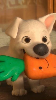 a white dog holding a toy carrot in it's mouth