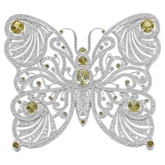 Designer: custom Material: 18K white gold Diamonds: round brilliant = 5.06cttw Yellow Sapphires: round brilliant= 4.71cttw Weight: 29.78 grams Diamond Butterfly, Butterfly Pin, Yellow Citrine, Yellow Sapphire, White Sapphire, Sapphire Diamond, Gold Yellow, White Gold Diamonds, Round Brilliant