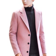 a young man in a pink coat and black turtle neck sweater standing against a white background