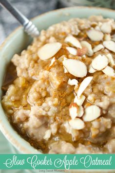 a bowl filled with oatmeal topped with almonds