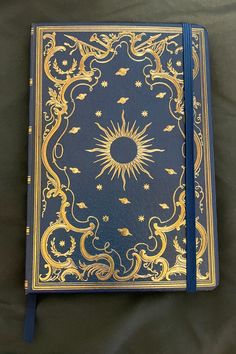 Beautiful celestial (Sun, planets, stars, etc.) gold foil journal with blue ribbon Planet Astrology, Book Rebinding, Press Ad, Book Cover Art Design, Peter Pauper Press, Binding Covers, Moon Reading, Book Cover Design Inspiration