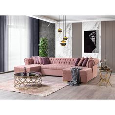 a living room with a pink couch and coffee table in front of a large window