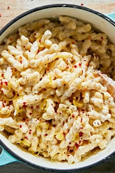 the macaroni and cheese dish is ready to be served in the pot on the table