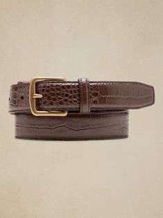 Sleek and streamlined, this embossed leather belt adds a bit of variety to your wardrobe.  LEATHER WORKING GROUP: By purchasing this product, you are supporting responsible leather manufacturing through the Leather Working Group.  Width: 1" (2. 5cm) Crocodile Belt, Money Belt, Buy List, Digital Closet, Designer Belts, Belt Style, Dress Belt, Brown Leather Belt, Brown Belt