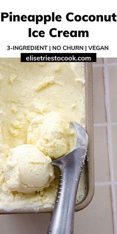 a scoop of pineapple coconut ice cream in a baking pan with a spatula