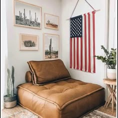 an american flag hanging on the wall above a futon