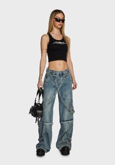 cuz conformity is the enemy of growth! These wide leg jeans have a washed denim construction, detachable grommet straps with clasp closures, front and back pockets, flap cargo leg pockets, pyramid studded detailing, a front zip-fly closure, and a convertible zip-off leg design so you can also wear them as shorts. Edgy Cargo Jeans With Five Pockets, Edgy Denim Jeans With Cargo Style, Denim Jeans For Alternative Fashion, Edgy Streetwear Cargo Jeans With Belt Loops, Edgy Denim Straight Leg Cargo Pants, Punk Style Denim Cargo Jeans For Streetwear, Wide Leg Denim Jeans For Alternative Fashion, Edgy Wide Leg Denim Cargo Jeans, Punk Style Straight Leg Denim Flare Jeans