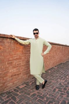 Color: Pistachio Green Fabric: Organic Cotton  Includes:  -Kurta -Trouser -Kurta Trouser:  Breathable Soft Cotton with good fall.  -Mandarin collar  -Full Sleeves  -This is a 2 Piece Stitched Outfit Customize Stitching Available Casual Green Kurta For Eid, Green Casual Kurta For Eid, Green Long Sleeve Kurta With Dabka, Green Kurta With Dabka And Long Sleeves, Fitted Long Sleeve Green Lawn Suit, Fitted Pista Green Lawn Suit With Dabka Details, Fitted Pista Green Lawn Suit With Dabka, Fitted Long Sleeve Pista Green Lawn Suit, Men Kurta