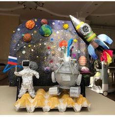 an image of a space station made out of paper machs and other items on a table