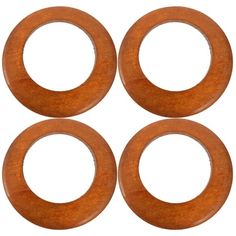 four wooden washers on a white background