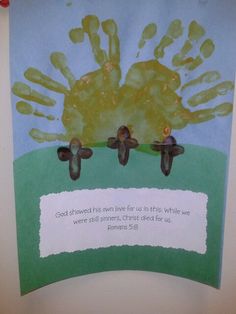 a child's handprint is displayed on a bulletin board