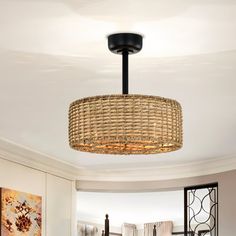 a living room with a round light fixture