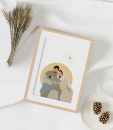 an image of a man and woman holding each other on a white surface next to a pine cone