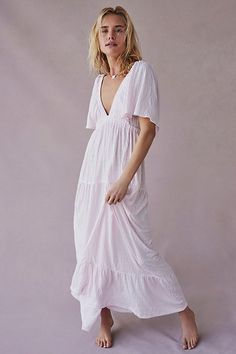 Forever free and flowy, this effortless maxi dress from our free-est collection is featured in a V-neck, tiered silhouette with flutter sleeves for added shape. * Soft, textured fabrication * Elastic empire waist * Effortless, pull-on style | La La Maxi Dress by free-est at Free People in Pink, Size: L Breezy V-neck Maxi Dress With Ruffles, Beach Dresses With Crinkle Texture And Short Sleeves, Beach Dresses With Crinkle Texture, Short Sleeve Crinkle Texture Beach Dress, Spring Maxi Dress With Crinkle Texture, Flowy V-neck Tiered Dress For Beach, Flowy V-neck Tiered Beach Dress, Feminine Flowy V-neck Tiered Dress, Chic Billowy Tiered Maxi Dress