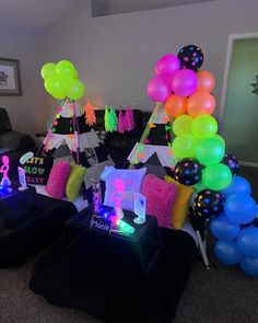 a party room with balloons and decorations