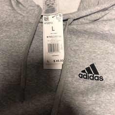 Adidas Light Gray Sweatshirt Size Large. New With Tags Adidas Cotton Sweatshirt For Sports, Adidas Cotton Tops For Sports Season, Adidas Tops With Ribbed Cuffs For Sports, Adidas Logo Print Tops For Fall, Basic Winter Tops With Logo Print, Adidas Gray Cotton Tops, Adidas Cotton Sweatshirt Relaxed Fit, Adidas Cotton Sweatshirt With Relaxed Fit, Adidas Relaxed Fit Cotton Sweatshirt