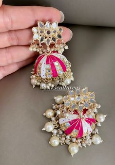 Stylish Beaded Cluster Pearl Meenakari Mirror Jhumka Earrings. Mirror Jhumkis. Truly a statement piece of jewelry. A must have earring in your trinket. Festive gift idea. Hot pink Jhumka, Green Jhumka, Blue Mirror Jhumki Earrings. 💥Ready to ship from USA 💥Quality Guarantee!! 💥Super Trendy 💥Statement Earrings  CARE TIP  1. Keep away from moisture and perfume 2. Store in cotton or zip lock bags or air tight boxes. 3. Spot cleaning only. 4. Jewellery is the last thing you should wear and the first thing you should remove. Send us an email if you need help!  SHIPPING & TURNAROUND  We follow item dispatch in 1-2 business days for most of our shipments. All pre orders will take approximately 3 - 4 weeks. We offer Free domestic delivery across US. Most deliveries are done in 2-5 business days Luxury Diamond Hand Set Jhumkas, Luxury Jhumkas With Cutdana For Gift, Luxury Jhumkas For Diwali Gift, Luxury Jhumkas With Intricate Design For Festive Occasions, Luxury Hand Set Jhumkas For Festive Occasions, Luxury Jhumkas For Diwali Rituals, Cheap Jhumkas For Diwali Celebration, Luxury Stone Work Jhumkas For Wedding, Luxury Multicolor Fusion Jhumkas