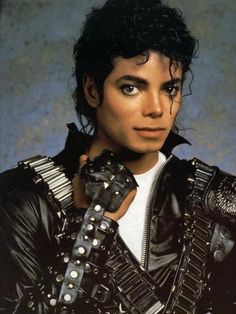 michael jackson as michael jackson in the film michael jackson is wearing black leather gloves with spikes on his arm