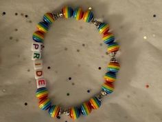 a colorful bracelet that says pride on it