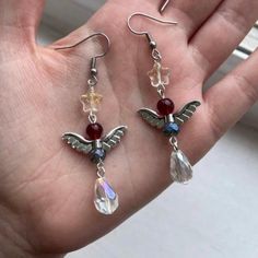 Add a touch of bookish flair to your wardrobe with these stylish dangle earrings! Handcrafted from high-quality glass and steel materials, these unique earrings are inspired by The Bone Season book series by Samantha Shannon. With their eye-catching design and vibrant colors, these earrings are perfect for adding a fun and trendy twist to any outfit. They are a perfect gift for the fantasy reader in your life Make a statement and show off your love for reading with these one-of-a-kind earrings t The Bone Season, Samantha Shannon, The Bone, Unique Earrings, Steel Material, Book Series, Jewelry Earrings Dangle, Bones, Dangle Drop Earrings